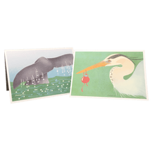 Load image into Gallery viewer, 2 holiday cards: whale tail emerging from water and heron holding red bauble in its beak.