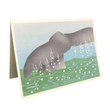 Load image into Gallery viewer, Holiday card with whale tail emerging from green water dotted with white stars.