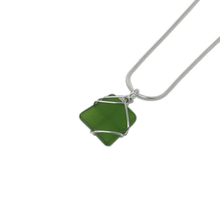 Load image into Gallery viewer, Kiwi green rectangular glass pendant encased in silver wiring, on silver snake chain.
