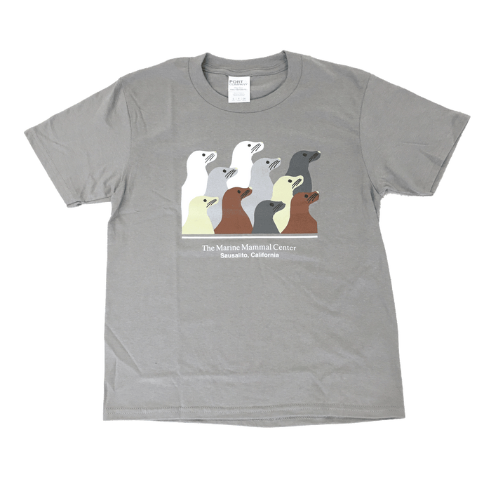 Light gray youth t-shirt with ten sea lion profiles in white, gray, tan and brown. Text 