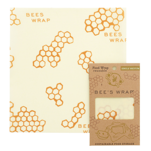 Square sheet of reusable wrap with honeycomb pattern and text "Bees Wrap" next to cardstock package.