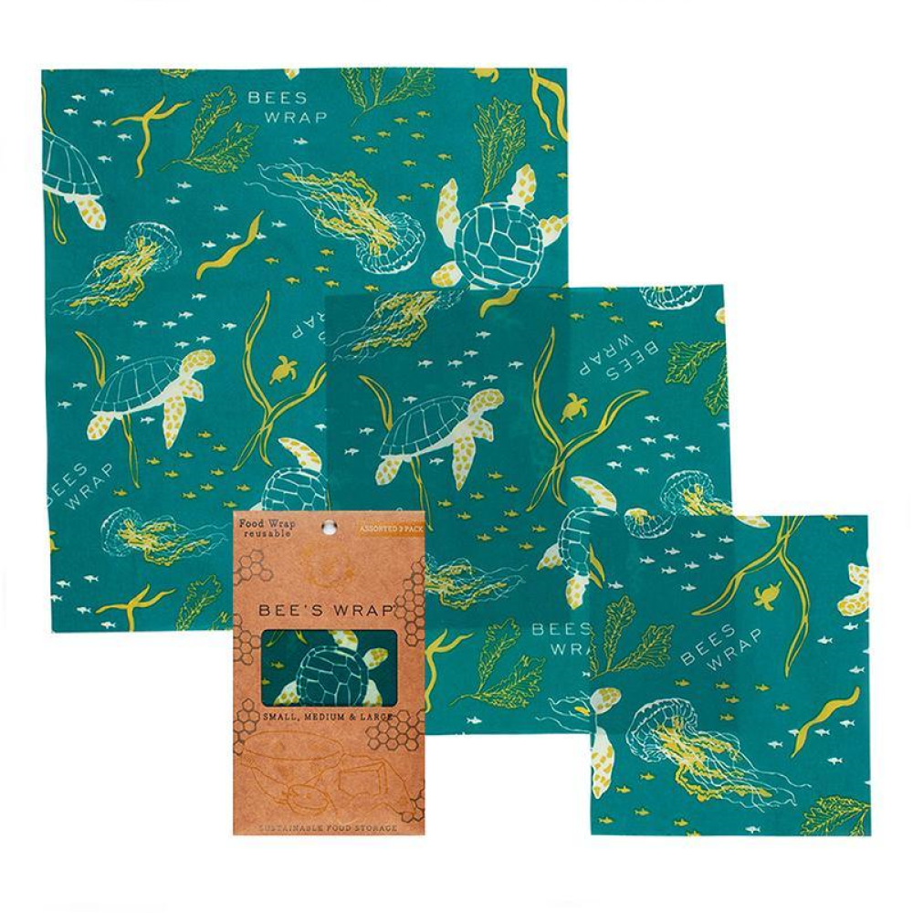 3 sheets of reusable beeswax wraps with ocean pattern that includes images of turtles, sea jellies, seagrass, and fish. 