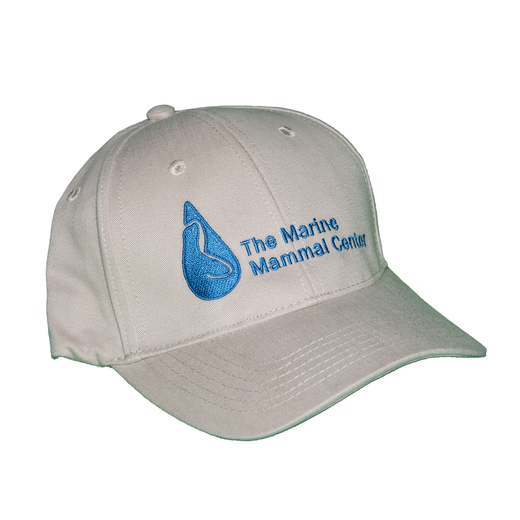 Khaki/light tan baseball cap with Marine Mammal Center logo in blue