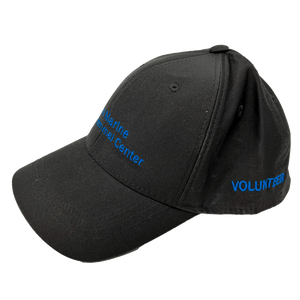 Dark grey baseball cap with blue embroidery of the logo on the front and 'volunteer' on the side.
