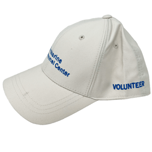 Khaki baseball cap with blue embroidery of the logo on the front and 'volunteer' on the side.