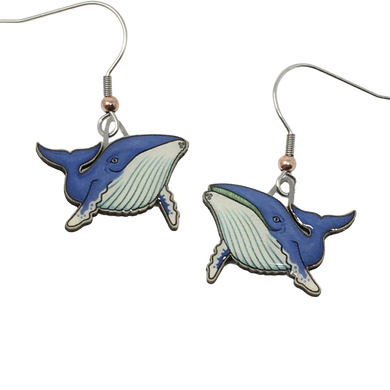 Blue and white glossy earrings in shape of swimming humpback whales; whale on right has mouth open showing green baleen. Copper bead at base of each ear wire.