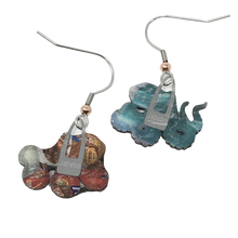Load image into Gallery viewer, Back of earrings show various colors, letters, and patterns from cereal boxes.

