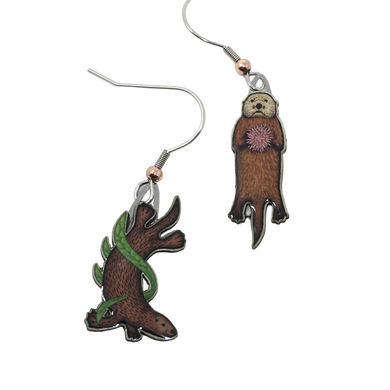 Mismatched earrings in shape of sea otters; left: otter diving in green kelp, right: swimming otter with purple sea urchin on chest. Copper bead at base of each ear wire.
