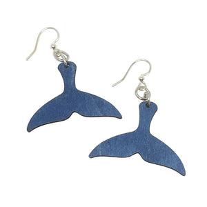 Two blue wooden earrings in the shape of a whale fluke/tail linked to silver earring hooks.