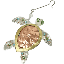 Load image into Gallery viewer, Silver and copper-colored metal ornament in shape of sea turtle, with blue, green, and white beads.
