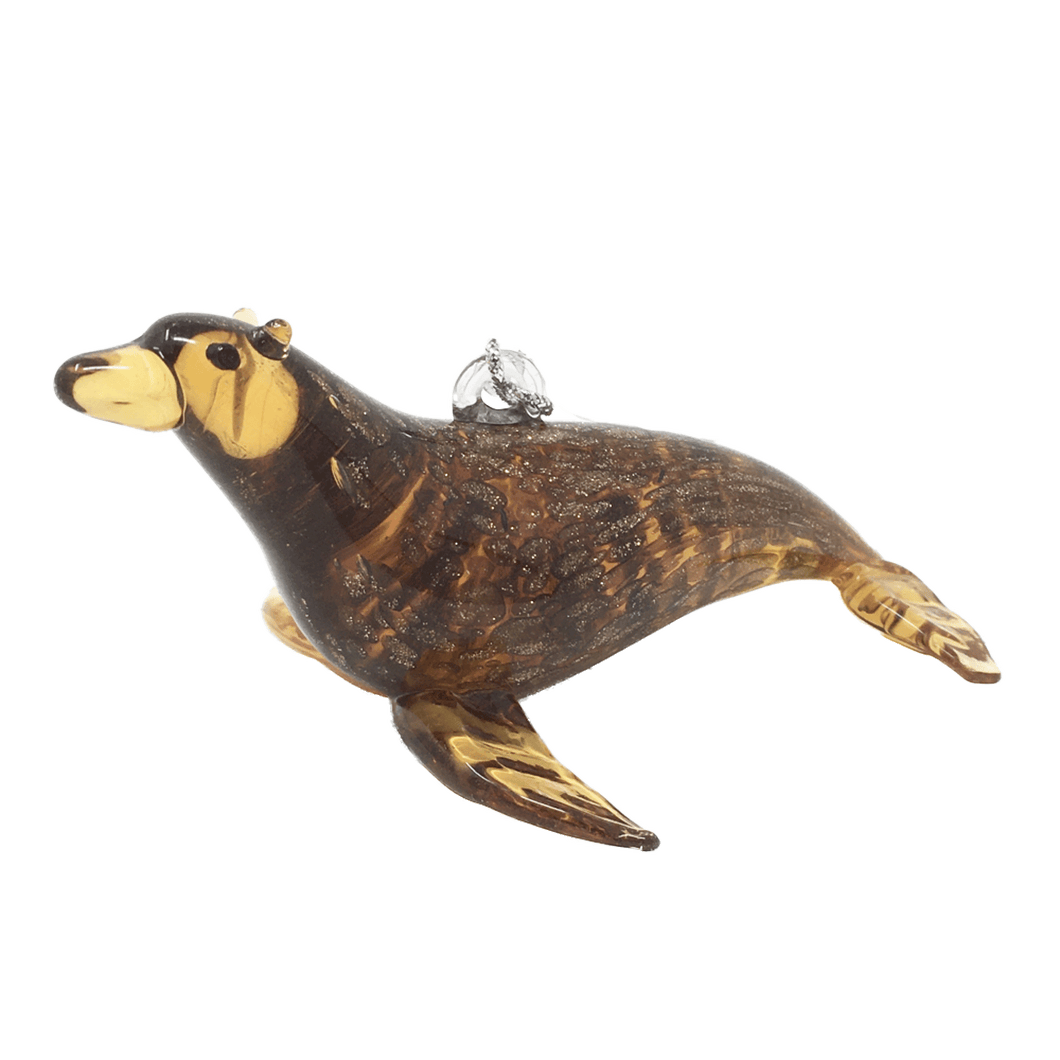 Glass sea lion ornament, tan and brown with gold glitter.