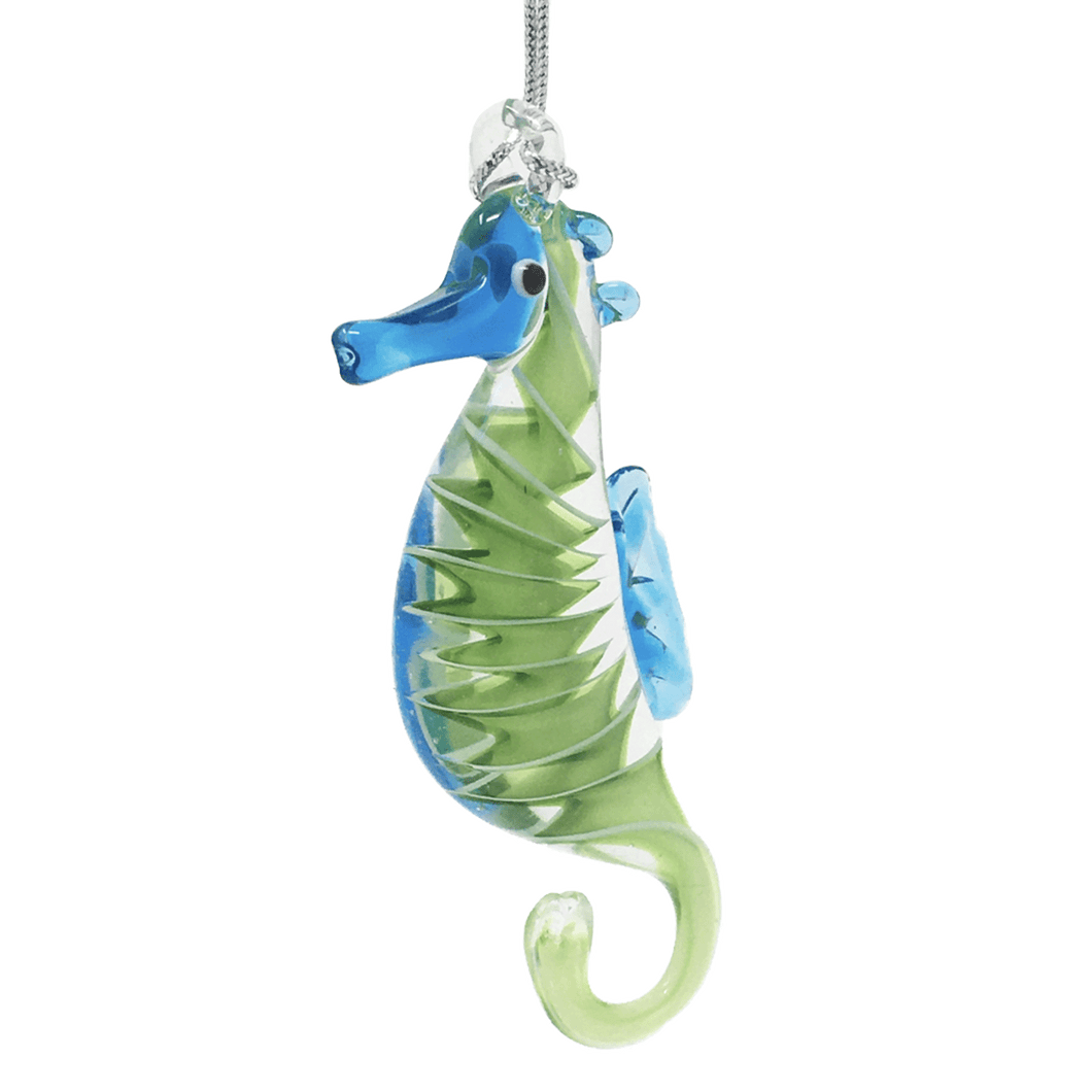 Blue and green glass seahorse ornament with spiral design in midsection.