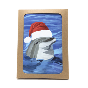 Box of holiday cards with dolphin wearing Santa hat on cover.