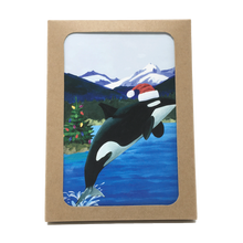 Load image into Gallery viewer, Box of holiday cards with leaping orca wearing Santa hat on cover.
