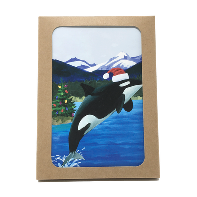 Box of holiday cards with leaping orca wearing Santa hat on cover.