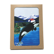 Box of holiday cards with leaping orca wearing Santa hat on cover.