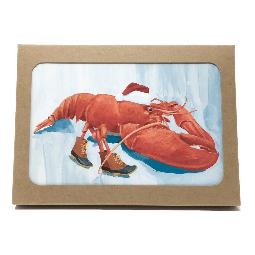 Box of holiday cards with lobster wearing Santa hat and boots on cover.