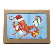 Load image into Gallery viewer, Box of holiday cards with red octopus wearing Santa hat and carrying 3 wrapped gifts on cover.
