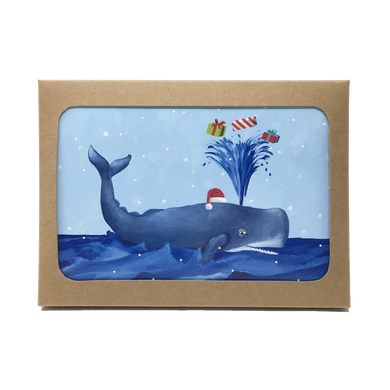 Box of holiday cards with sperm whale wearing Santa hat and spouting gifts on cover.