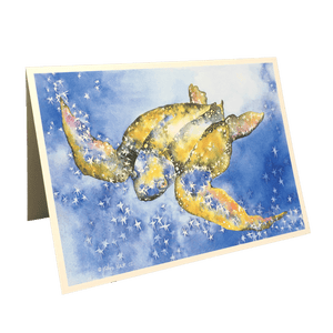 Holiday card with green and yellow leatherback sea turtle against blue background dotted with white stars.