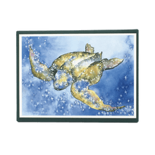 Load image into Gallery viewer, Holiday card box cover with green leatherback sea turtle against blue background dotted with white stars.
