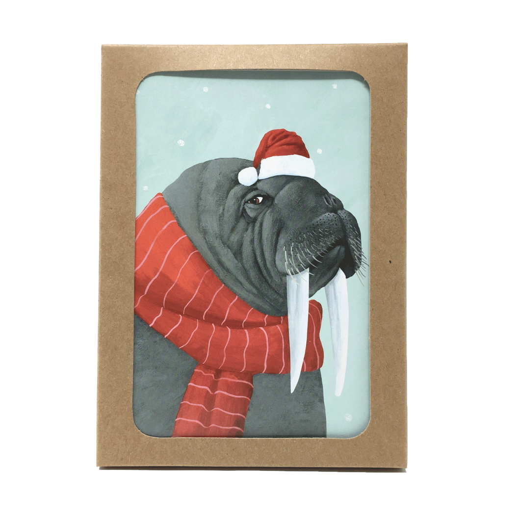 Box of holiday cards with walrus wearing scarf and Santa hat on cover.