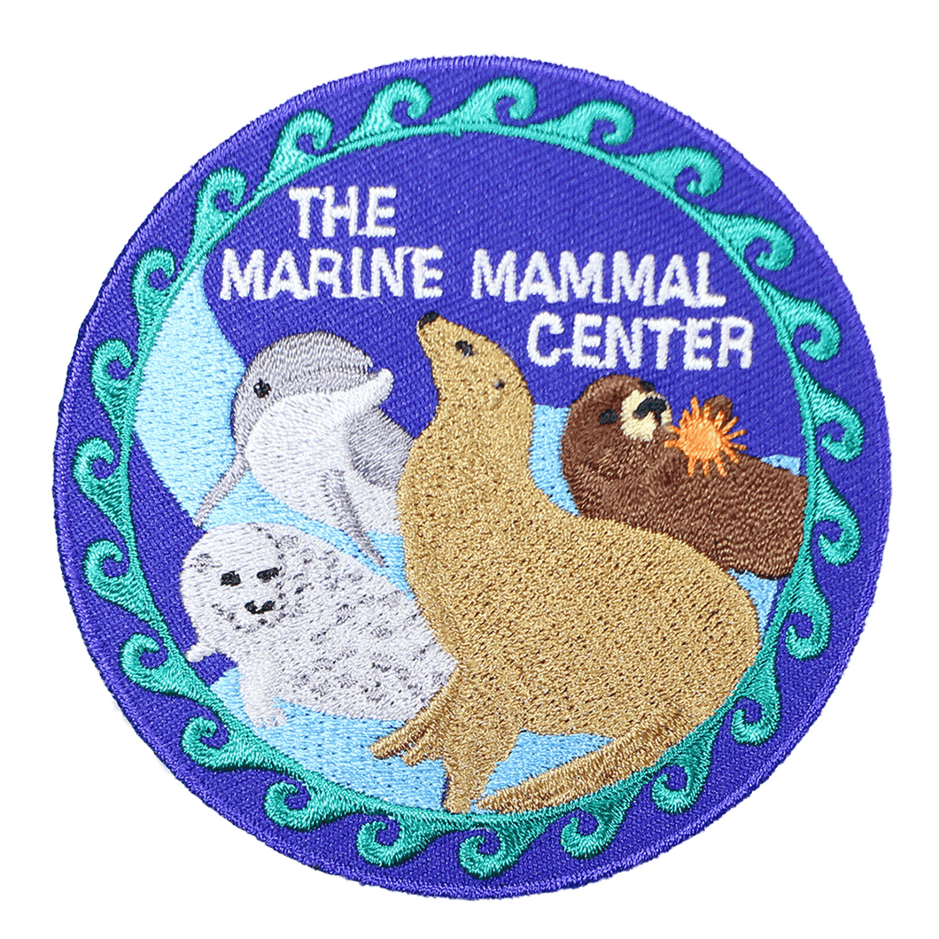 Blue patch depicting marine mammals, a sea otter, sea lion, harbor seal, and dolphin, and 