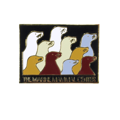 Rectangular lapel pin with 10 sea lion profiles in white, gray, tan, and brown. Text 
