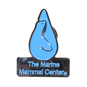 Light blue enamel pin with The Marine Mammal Center logo and name with trademark, silver lining backs the pin and outlines the logo and name.