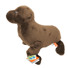 Load image into Gallery viewer, Side view of a dark brown plush sea lion with plastic eyes and orange and green tag.
