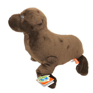 Side view of a dark brown plush sea lion with plastic eyes and orange and green tag.