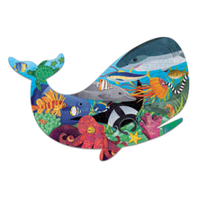 Load image into Gallery viewer, Completed whale shaped puzzle filled with images of sea animals, including a seahorse, a seastar, a sea turtle, a sea lion, and more.
