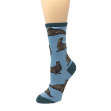 Load image into Gallery viewer, Sky blue elephant seal socks on foot mannequin
