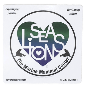 Circular sticker with blue and green heart design containing white letters "SEA LIONS" and "The Marine Mammal Center" in black text below. Heart is flanked by 2 sea lion silhouettes.
