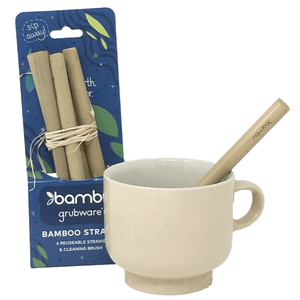 Straws in packaging next to single straw in tan mug.