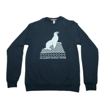 Load image into Gallery viewer, Navy blue sweatshirt with design in white of a sea lion perched on a rock above waves. Below the waves are the words THE MARINE MAMMAL CENTER in all caps.
