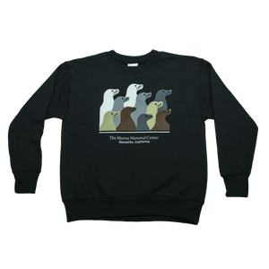 Black crew-neck sweatshirt featuring design with 10 sea lion profiles in white, gray, tan, and brown on front. Text "The Marine Mammal Center Sausalito, California" beneath design.