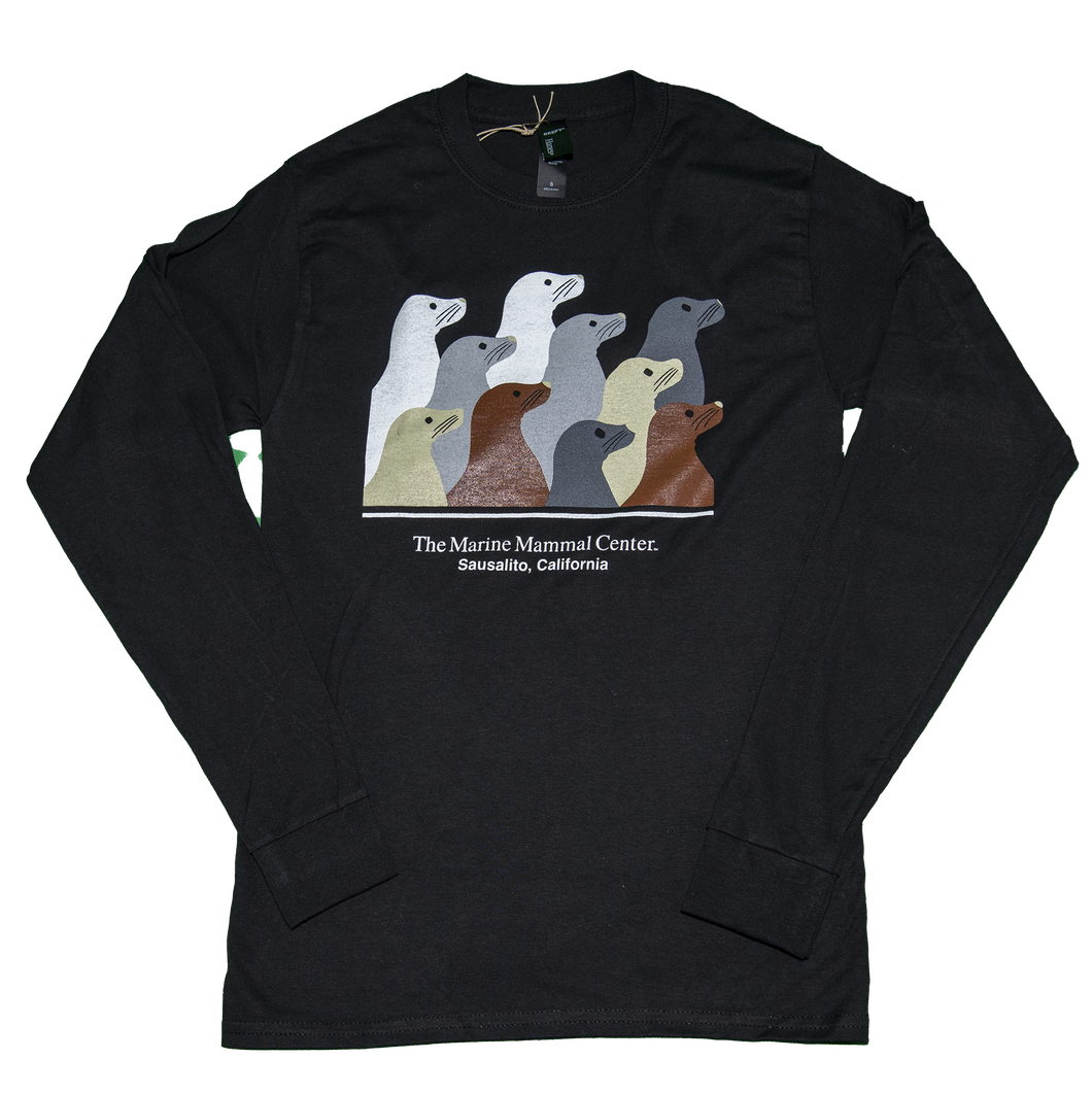 Black long-sleeve t-shirt featuring design with 10 sea lion profiles in white, gray, tan, and brown on front. Text 