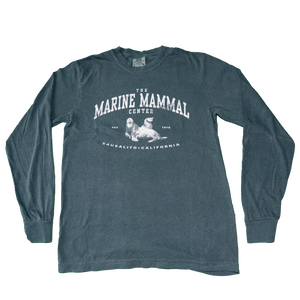 Longsleeve green t-shirt with a weathered, vintage appearance. The design is centered on the chest depicting a pair of sea lions with "The Marine Mammal Center est. 1975 Sausalito California" in white ink.