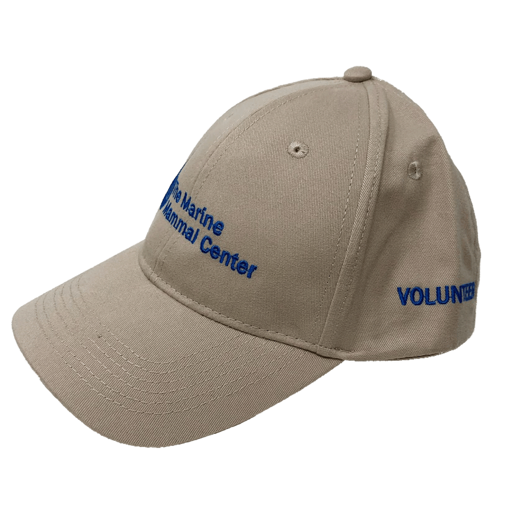 Khaki baseball cap with blue embroidery of the logo on the front and 'volunteer' on the side.