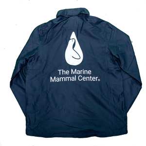 Back of navy blue windbreaker with The Marine Mammal Center's logo in white, centered and extra-large
