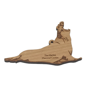 2D laser-cut wood elephant seal ornament with The Marine Mammal Center engraved.