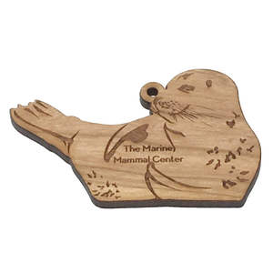 2D laser-cut wood harbor seal ornament with The Marine Mammal Center engraved.